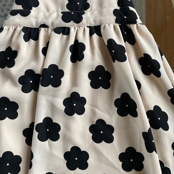 Cream and Black Floral Mini Dress with Cut out sides, sinch waist and skirt - Picture 3 of 7